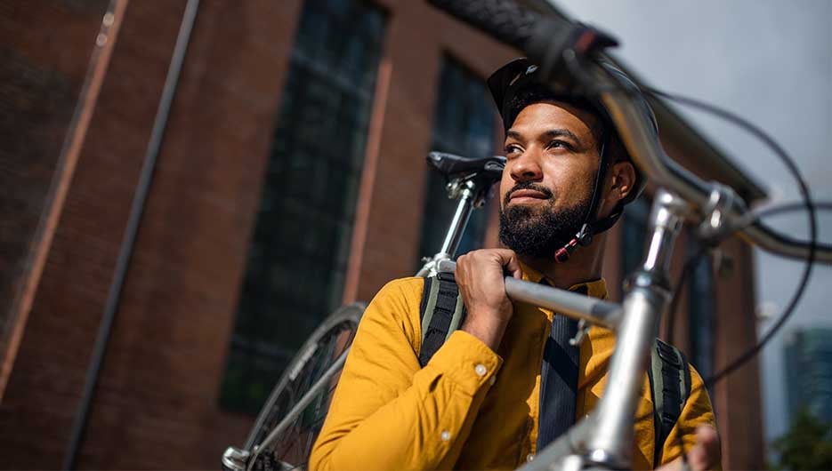 man holding his bike